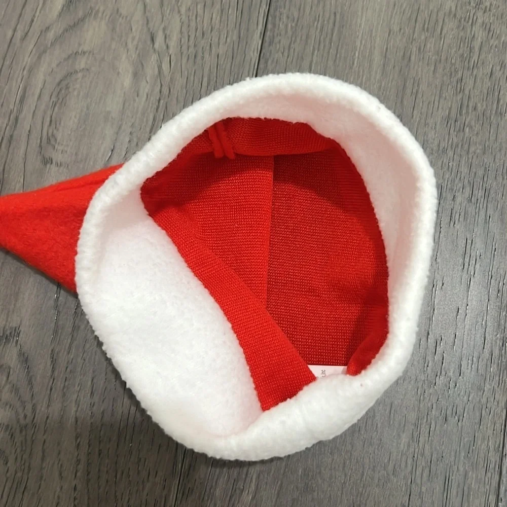 NWOT infant Santa hat with matching sock booties with pom-poms